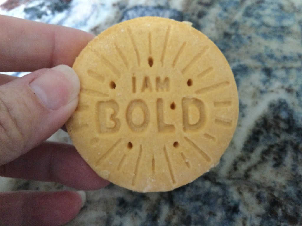 Image of a Girl Scout cookie that says, “I am bold.”
