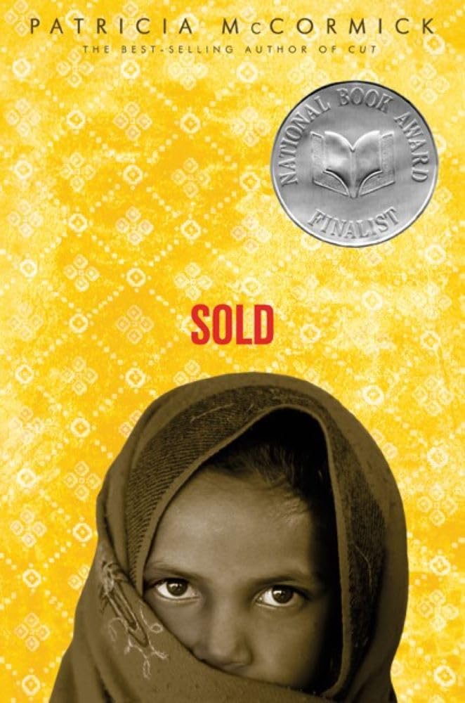 Book cover of “Sold” includes photo of the face of a young Nepalese girl with a headscarf against a gold background. 