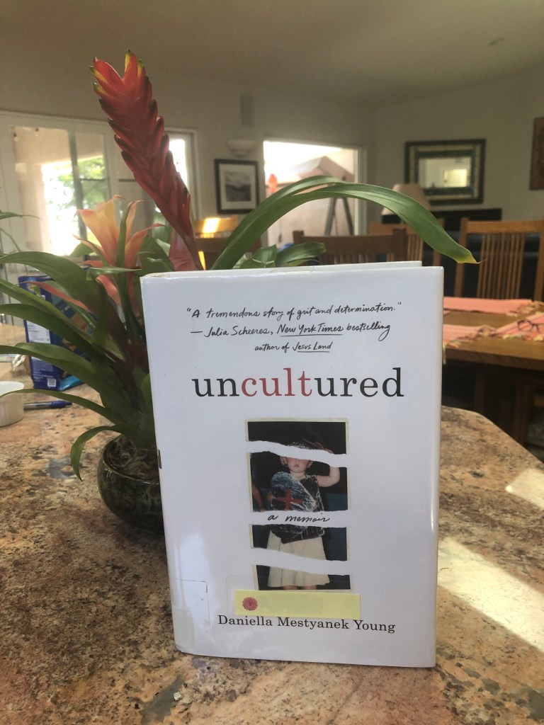 The book cover of “Uncultured” has a torn photo of what appears to be a small child in a ‘Christian soldier’ costume with a shiny fake shield. 